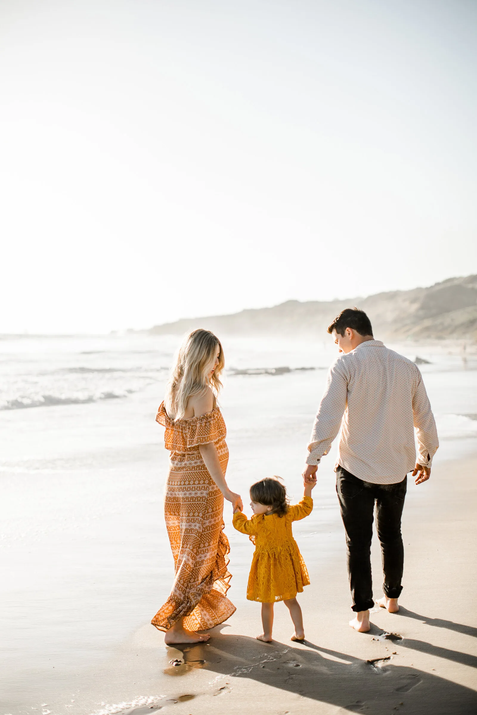 Family at the beach at sunset