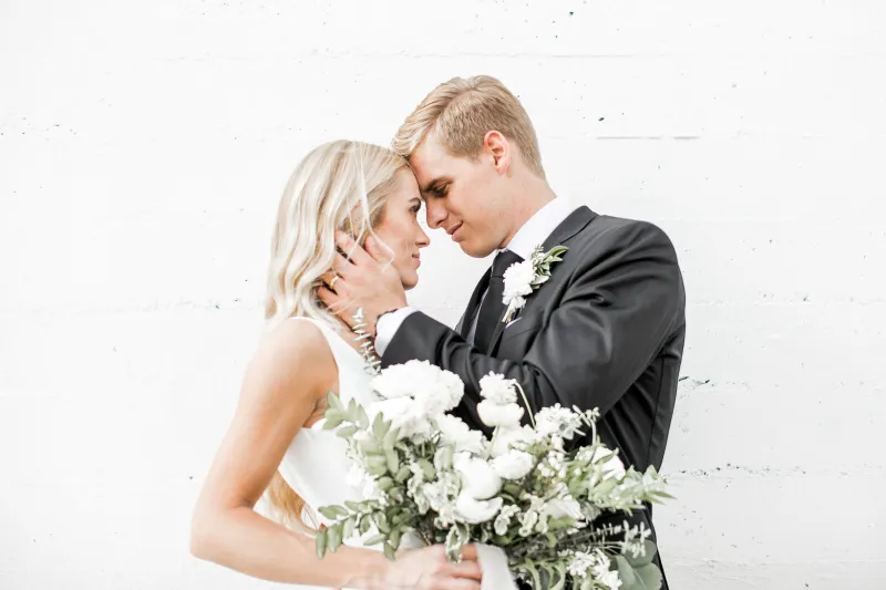 Bride and groom with the bouquet