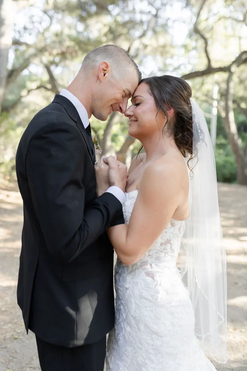 Bride and groom in the oaks after the ceremony